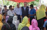Christos Stylianides, in the center, with UNHCR officers and members of the local ...