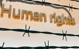 Tekst 'Human rights' achter prikkeldraad