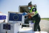 Boxes of protective masks are unloaded from a military airplane coming from Bucharest, Romania to Milan, Italy and load in a truck as part of the Operation RescEU in the context of the COVID-19 pandemic.